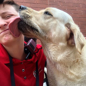 Camp counselor and guest at Care-A-Lot Resorts dog daycare